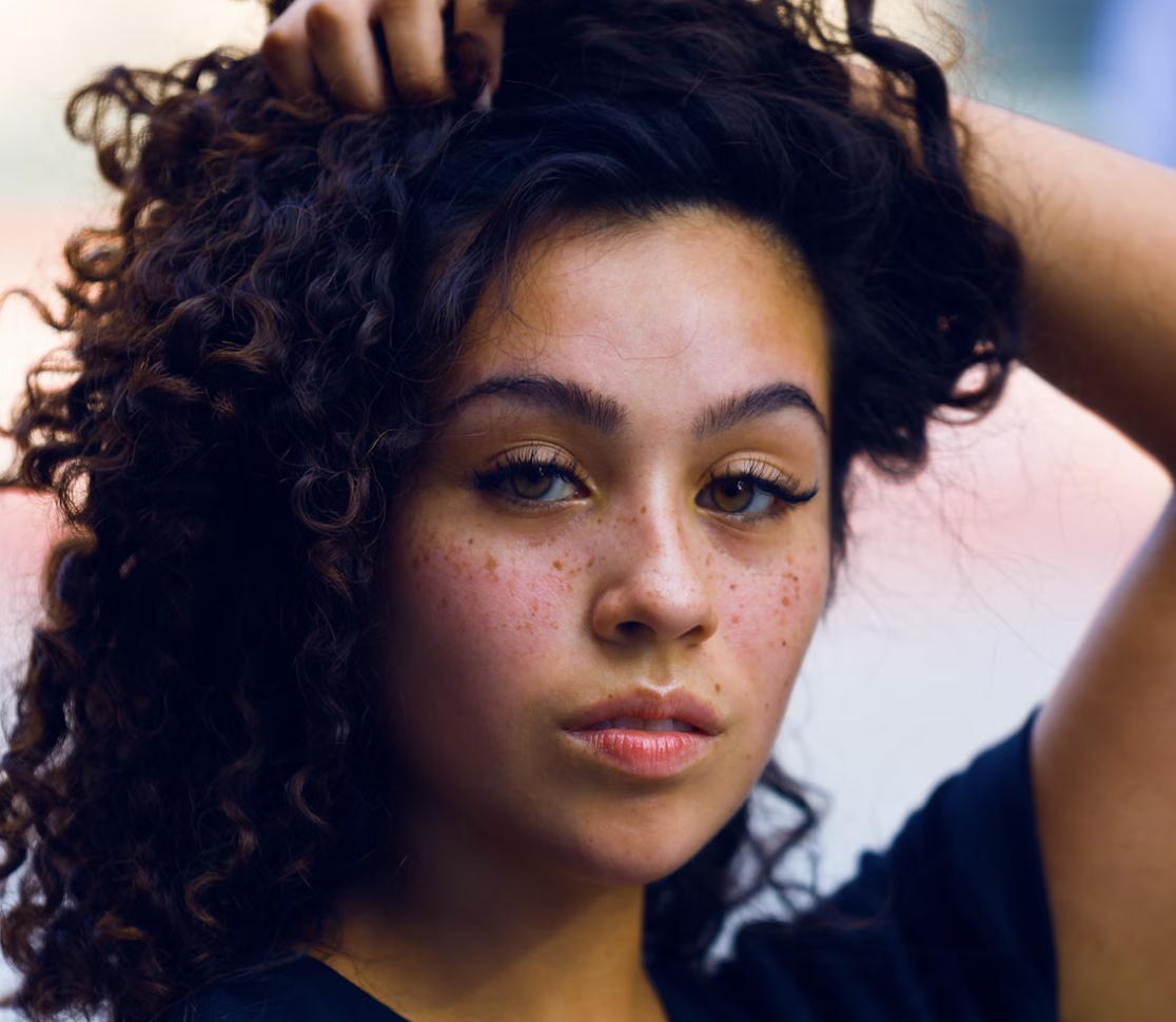 Freckled woman with curly hair
