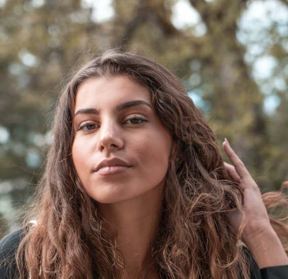 Woman with wavy brown hair